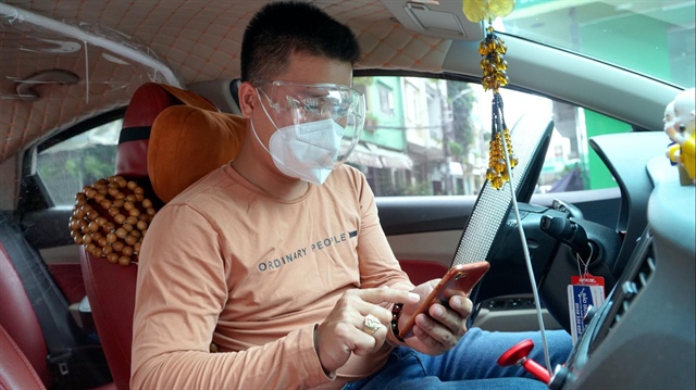 Bộ GTVT muốn 'biến' Grab, Gojek thành taxi truyền thống? - ảnh 1